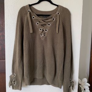 Women’s plus size Forever 21 sweater with grommet and lacing detail.